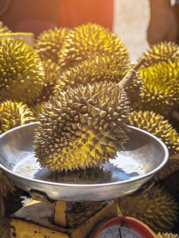 Durian fruit for sale at a market in kuala lumpur, malaysia.