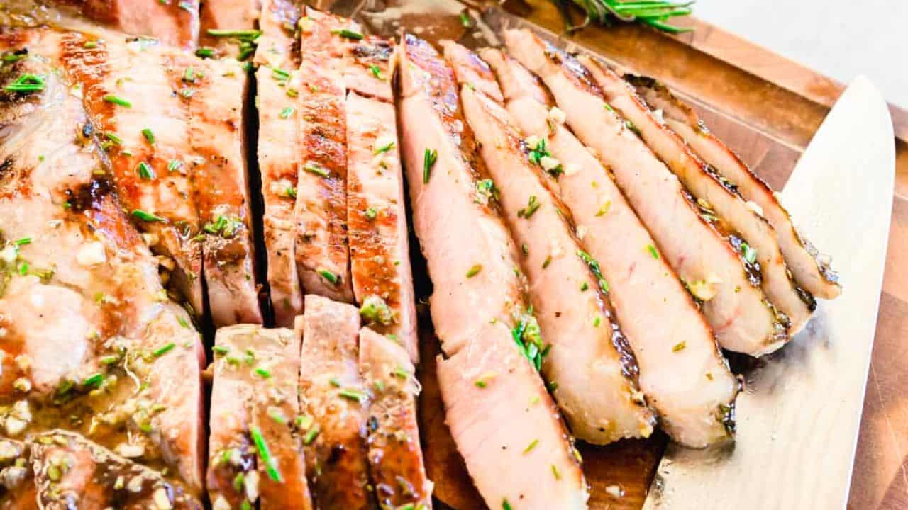 Grilled fresh ham steak with rosemary dijon maple glaze.