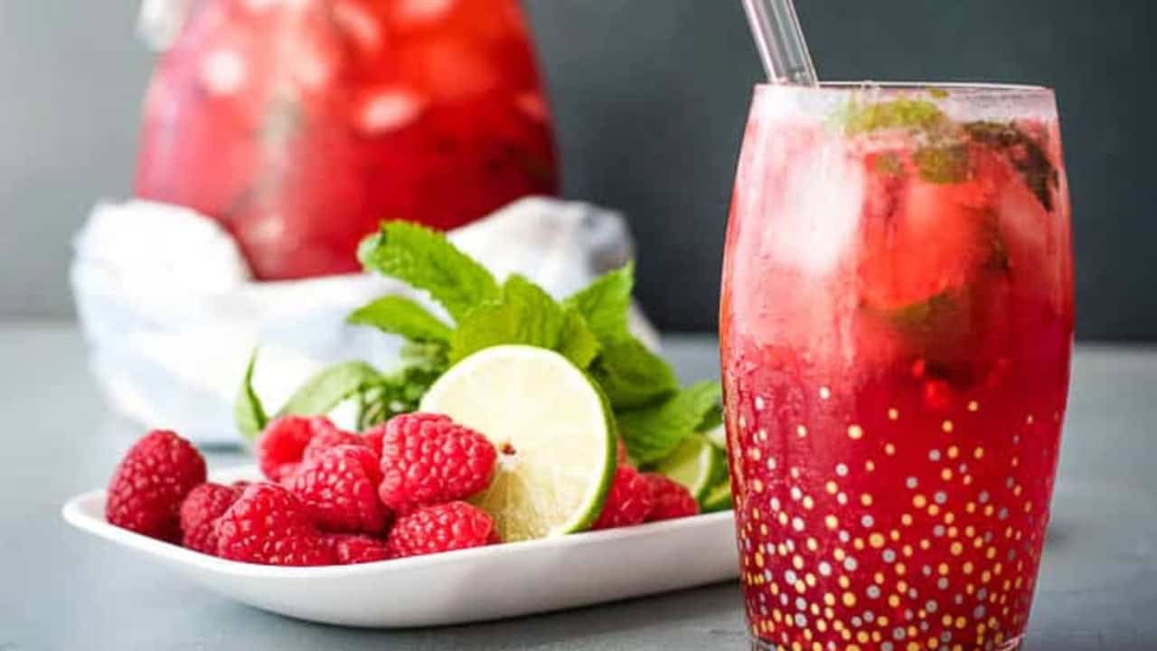 Raspberry mojito cocktails with a mojito party pitcher.