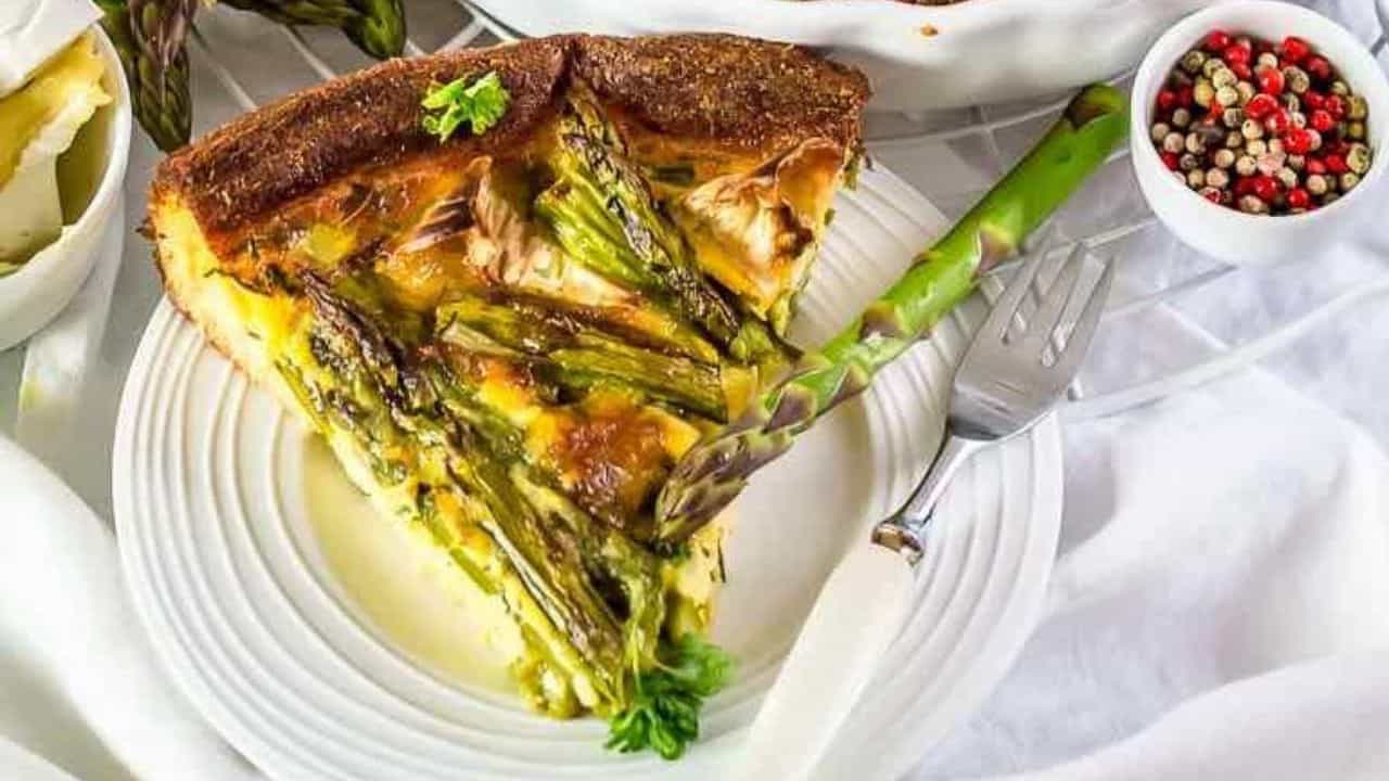 A white casserole with asparagus quiche.