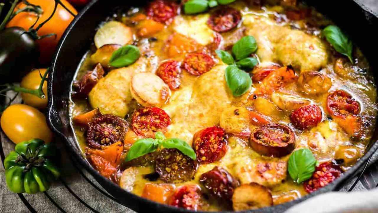 Tomato Mozzarella Baked Chicken inside cast iron.