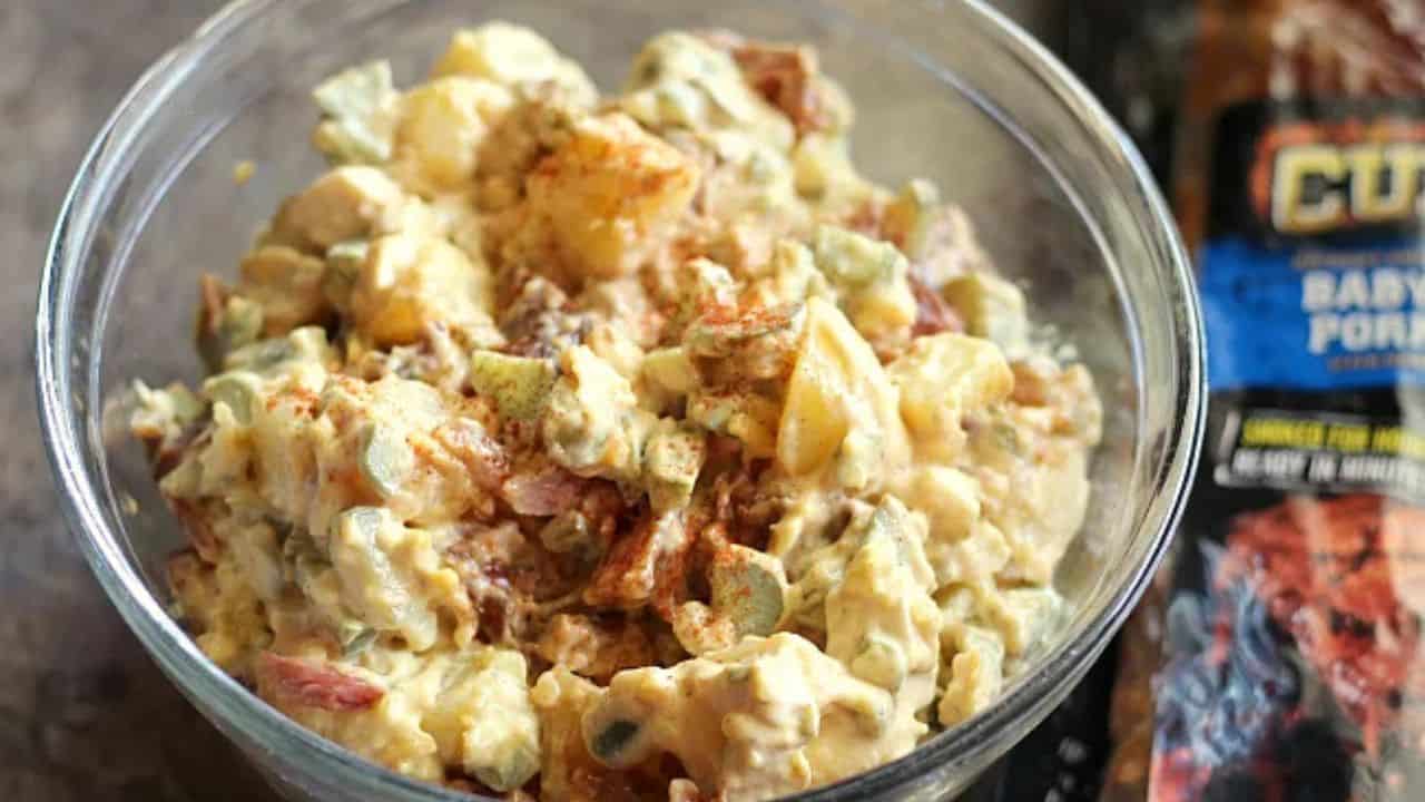 BBQ Rib Potato Salad on a light blue plate with a salad and ribs.