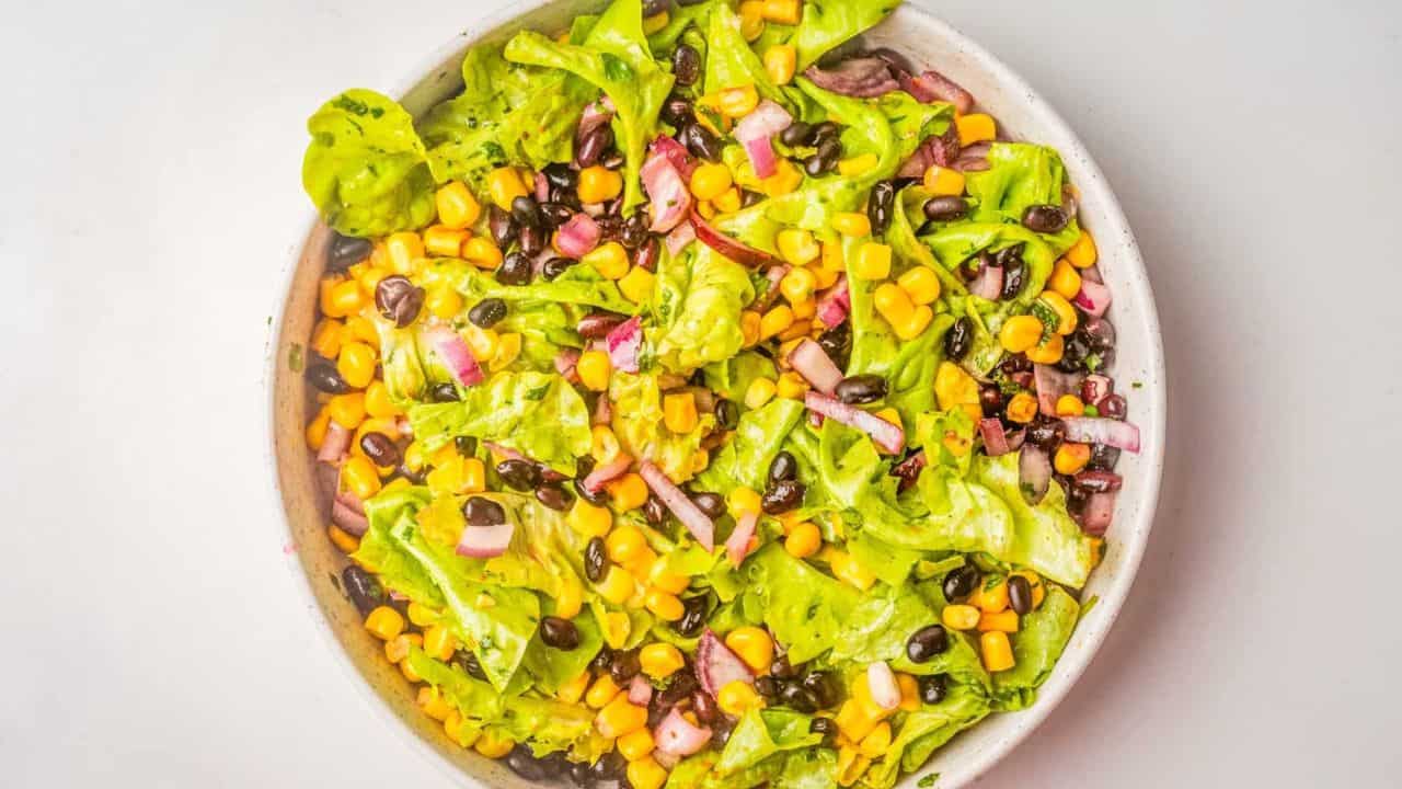 An overhead image of Mexican corn salad with the ingredients fully mixed together.