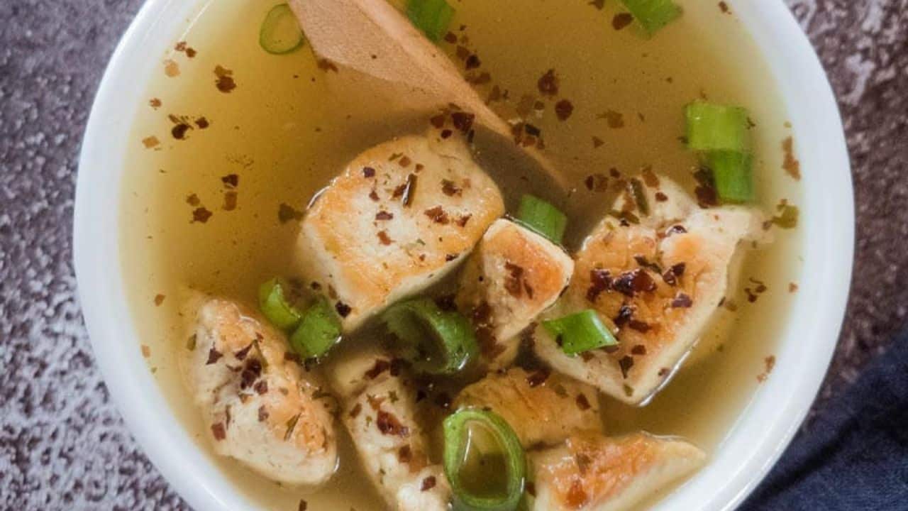 Chicken Miso Soup with seaweed and green onion garnish in a white soup bowl.