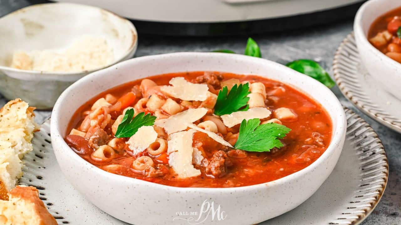Two bowls of Copycat Pasta e Fagioli Soup in front of an instant pot.