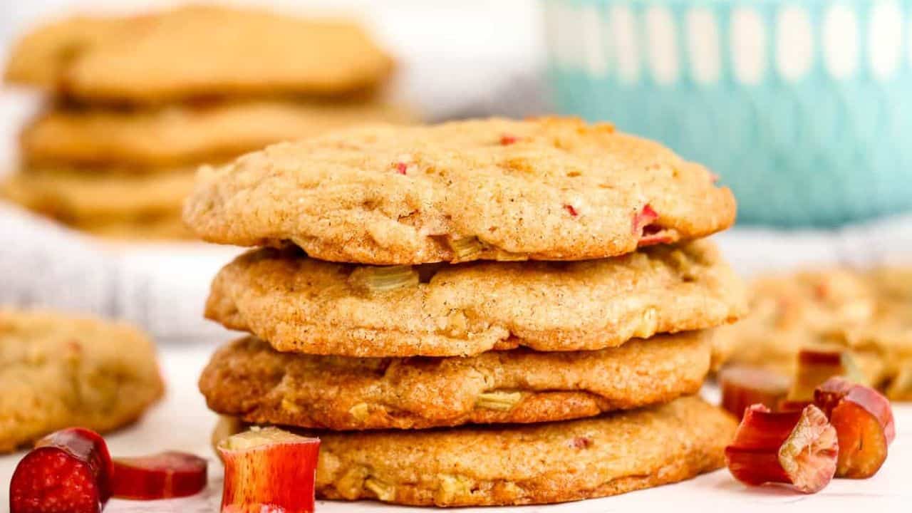 Stacked rhubarb cookies with slices of rhubarb.