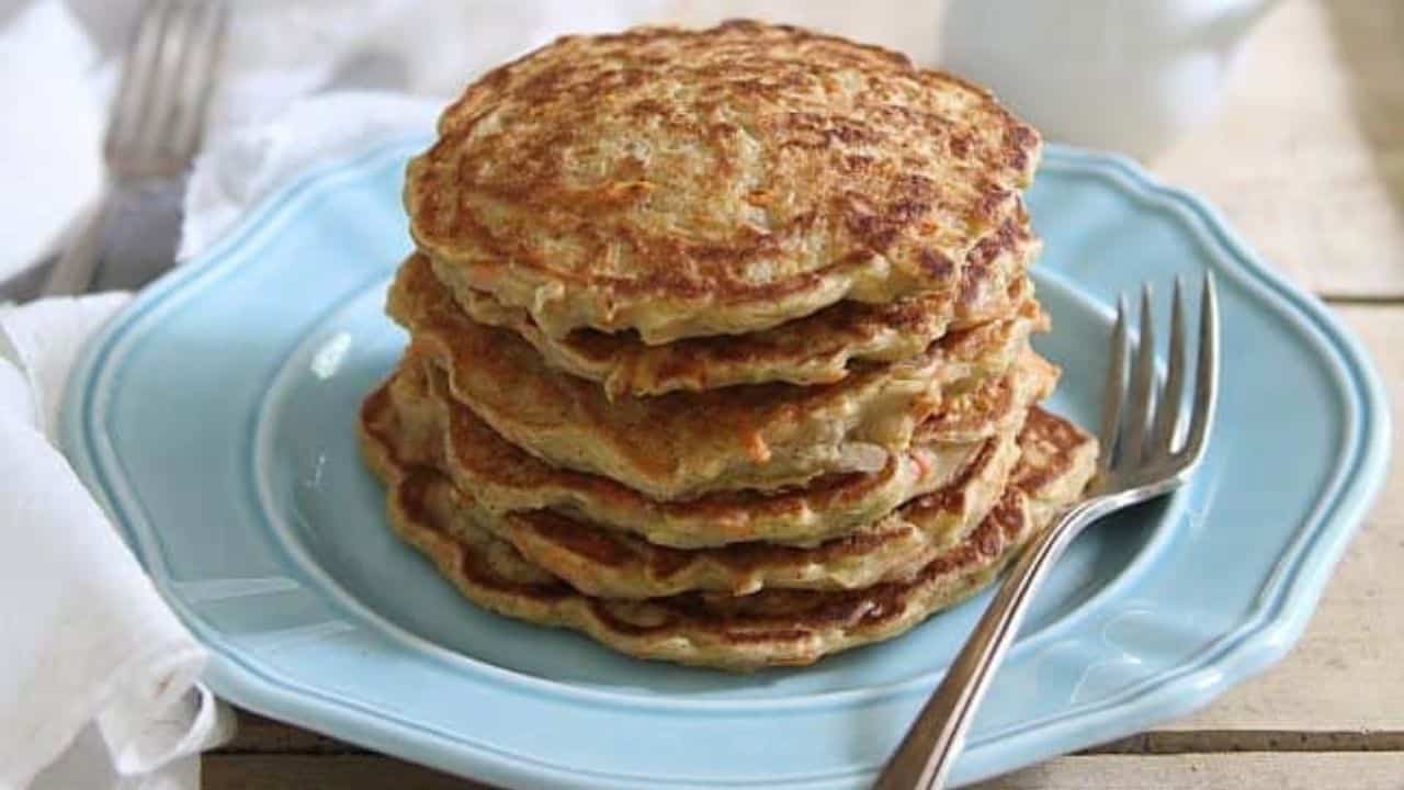 Apple carrot cake pancake stack with maple cream cheese sauce.