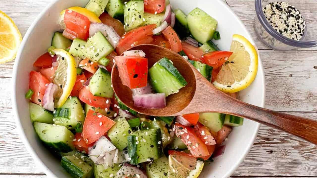 Light and refreshing Asian salad with cucumbers, tomatoes, and tangy dressing.