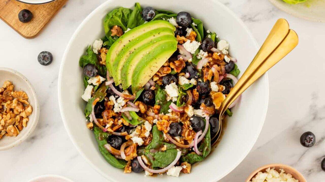 An overhead image of serving the salad in a bowl.