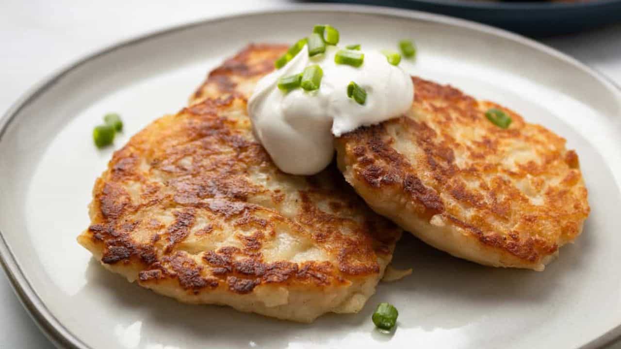 A close up image of Irish potato pancakes on a plate.