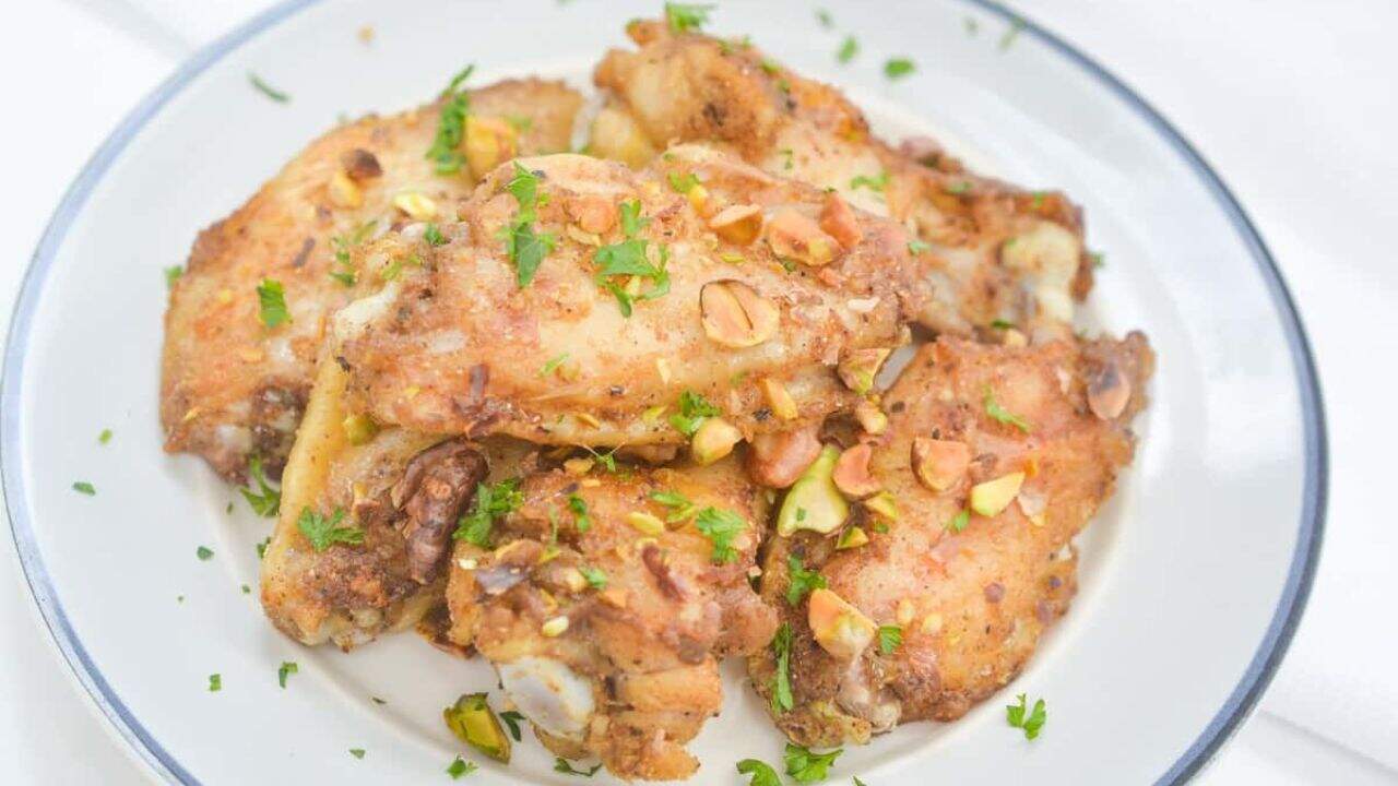 Chicken on a white plate.
