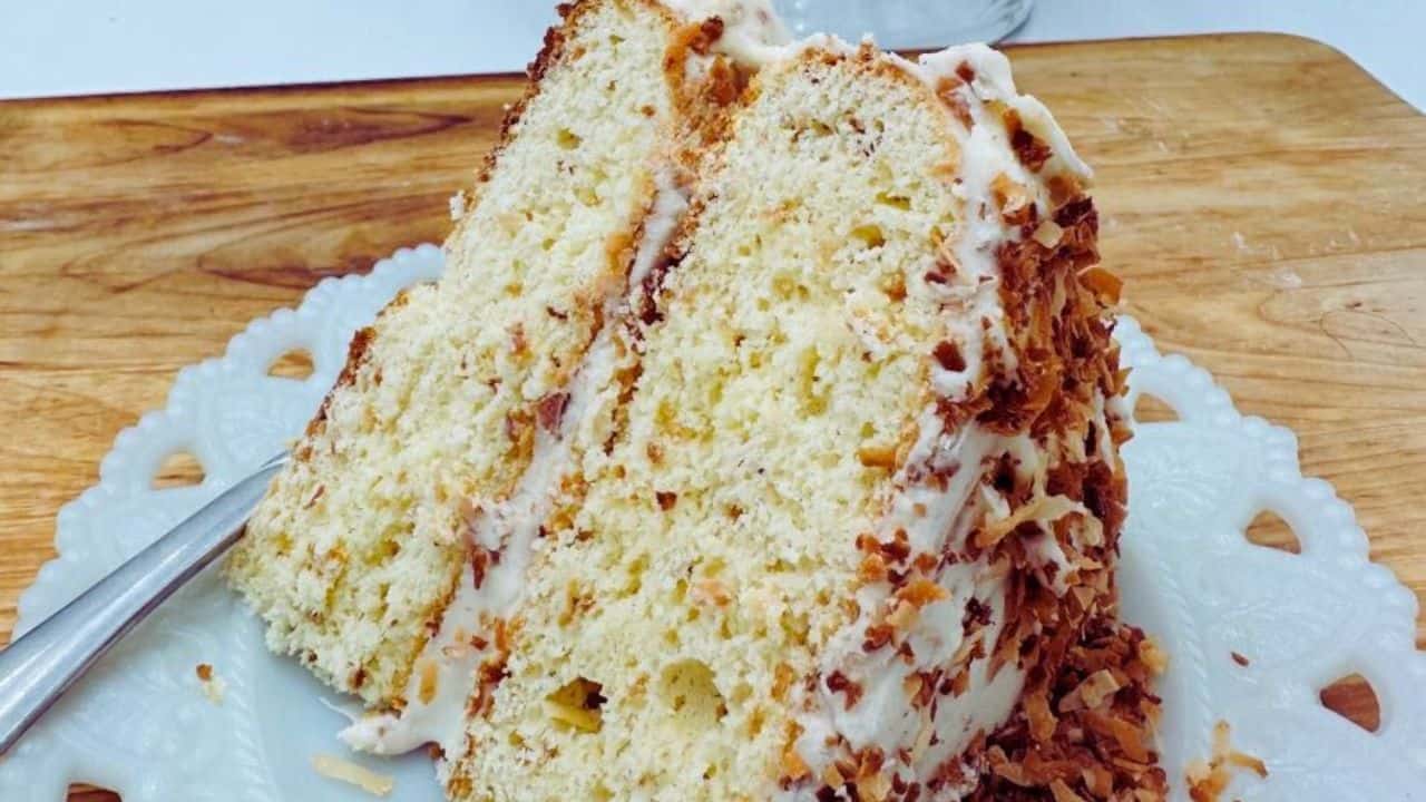 A cake with a slice taken out of it.