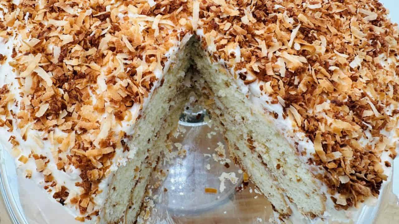 A cake with a slice taken out of it.