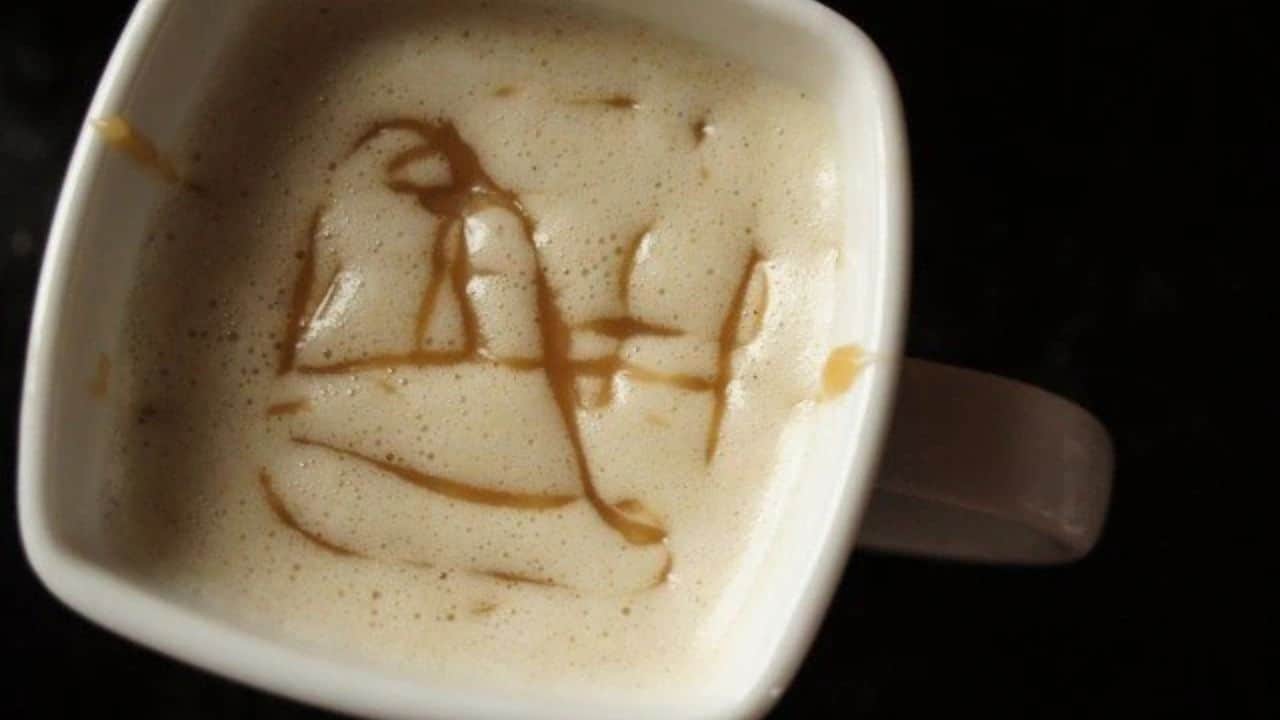 Image shows an overhead closeup shot of a mug with a Copycat Caramel Macchiato.