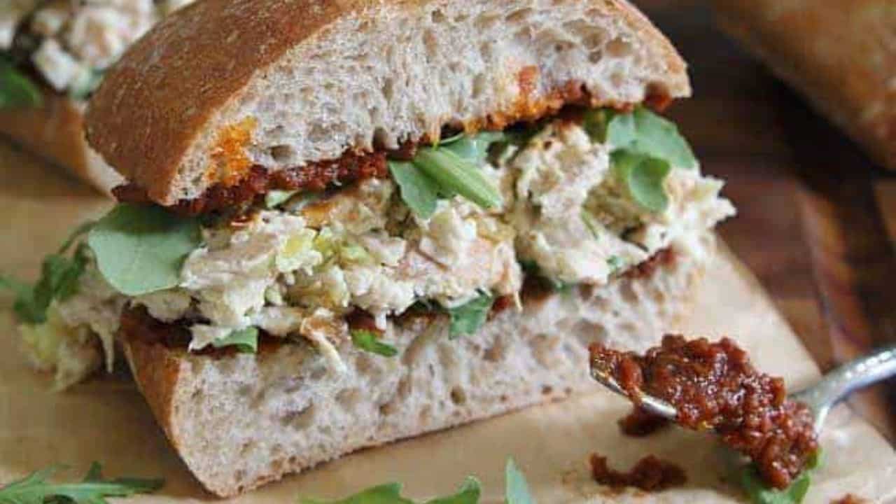 Garlic yogurt chicken salad sandwich with sun dried tomato pesto.