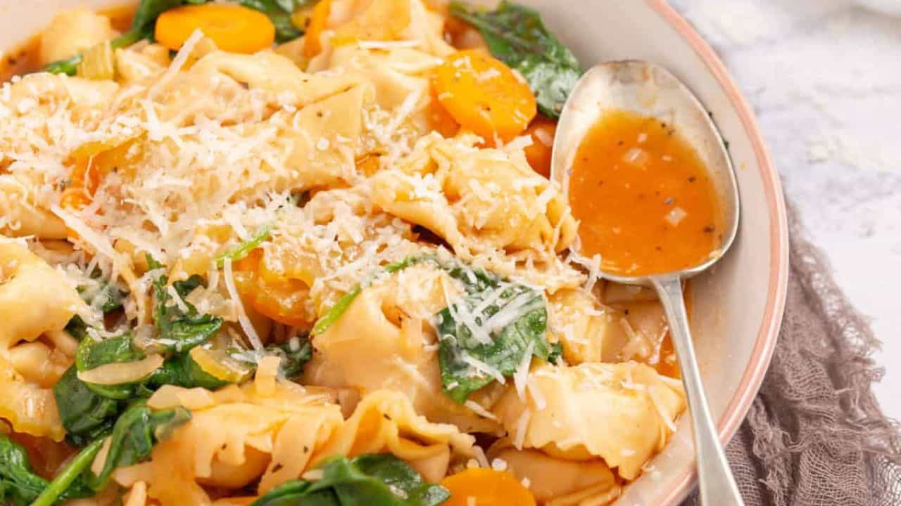 An image of instant pot tortellini soup in a bowl.