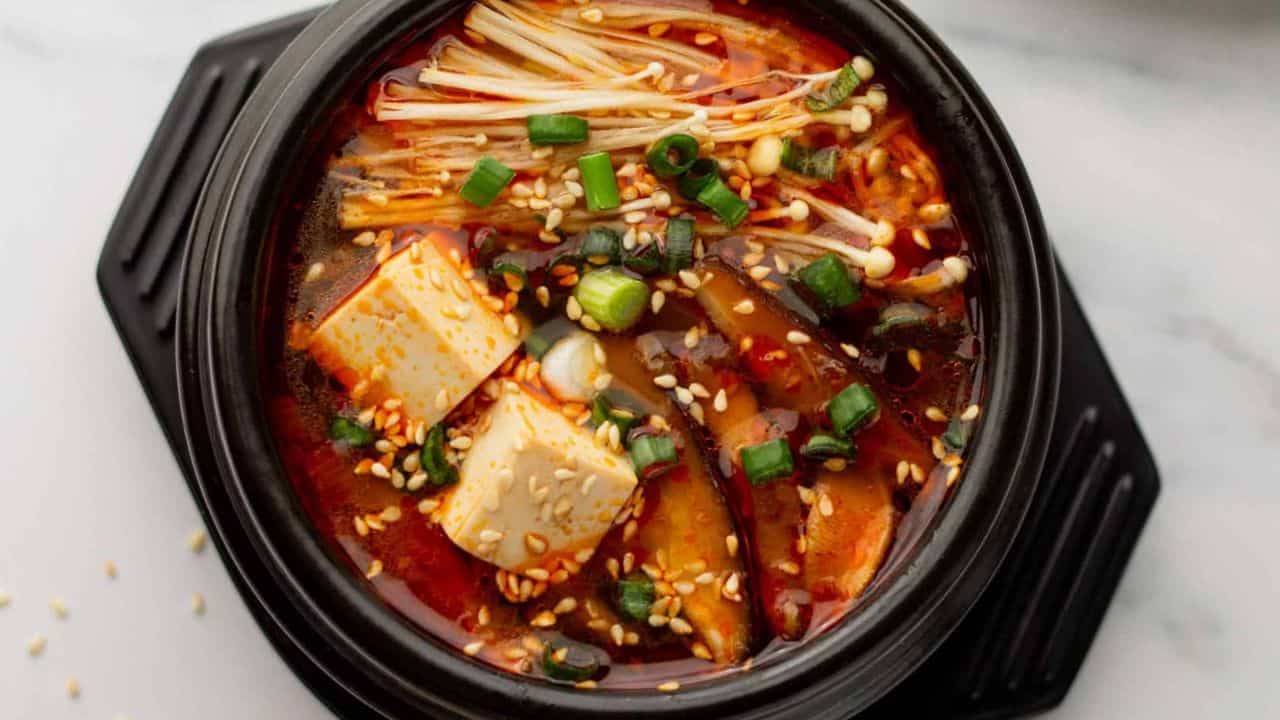 An overhead image of Korean tofu soup in a pot.