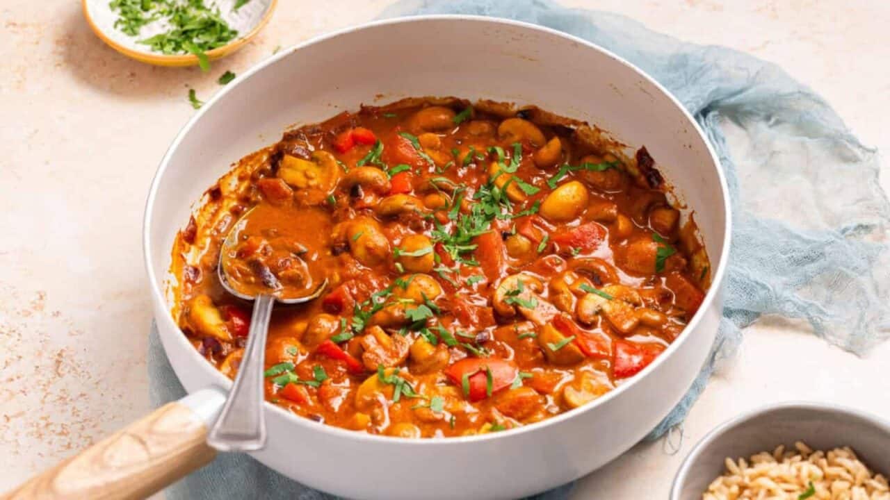 An image of cooked mushroom masala in a skillet.