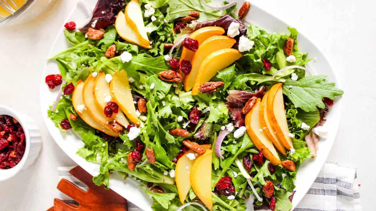 An overhead image of roasted pear salad on a serving plate.