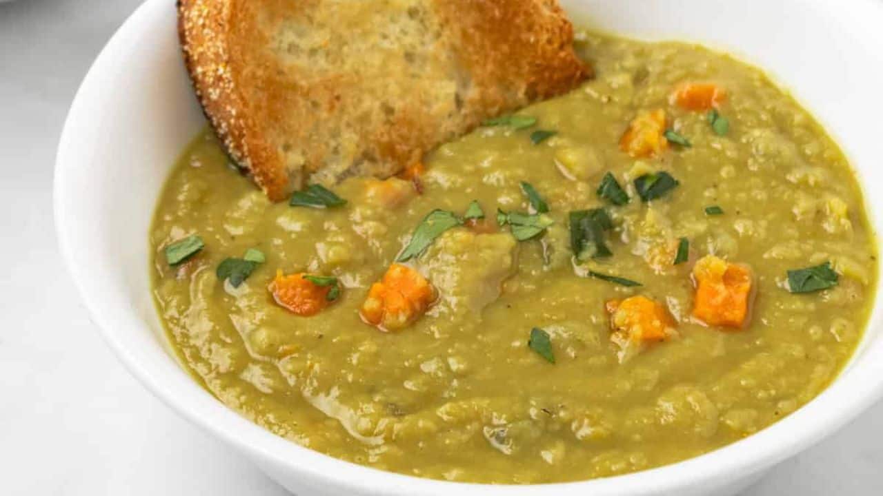 An image of split pea soup divided into two bowls.