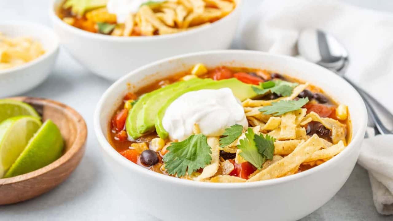 Top view of a bowl of slow cooker tortilla soup.