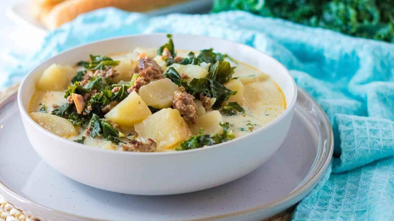 A Slow Cooker Zuppa Toscana with potatoes and kale.