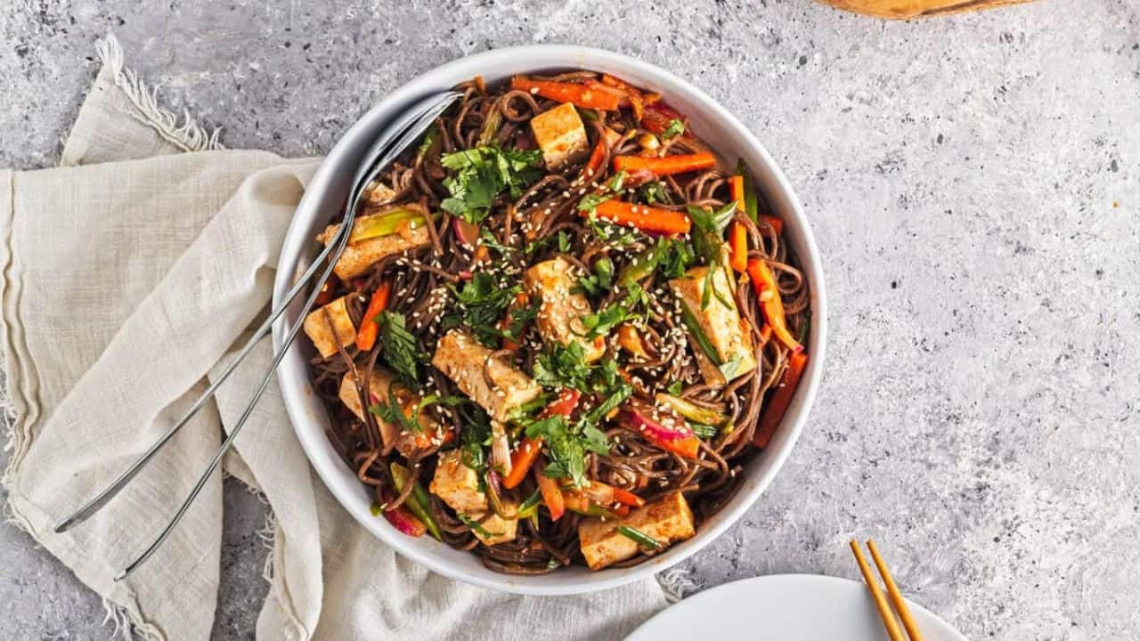 An overhead image of spicy soba noodles in a bowl.
