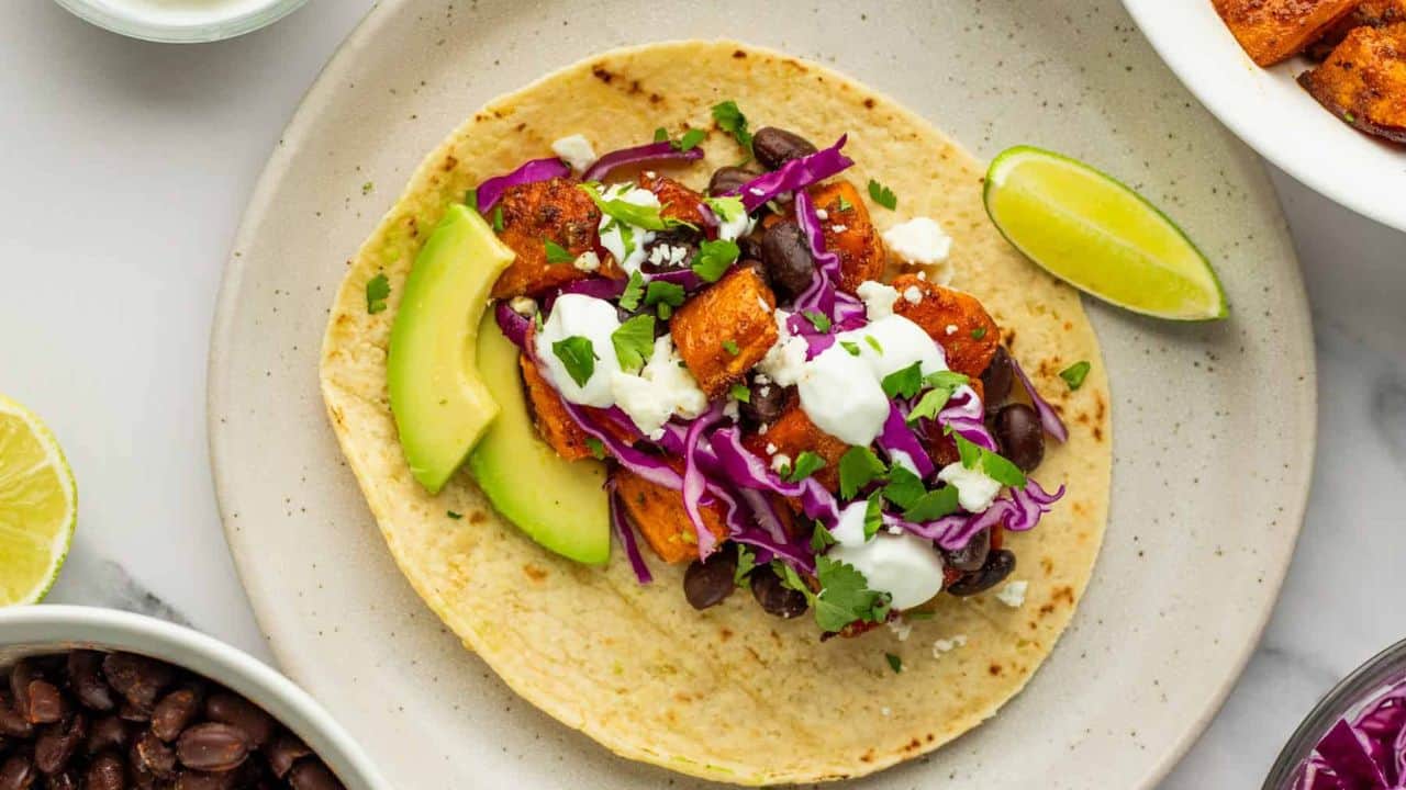 An overhead image of three sweet potato black bean tacos.