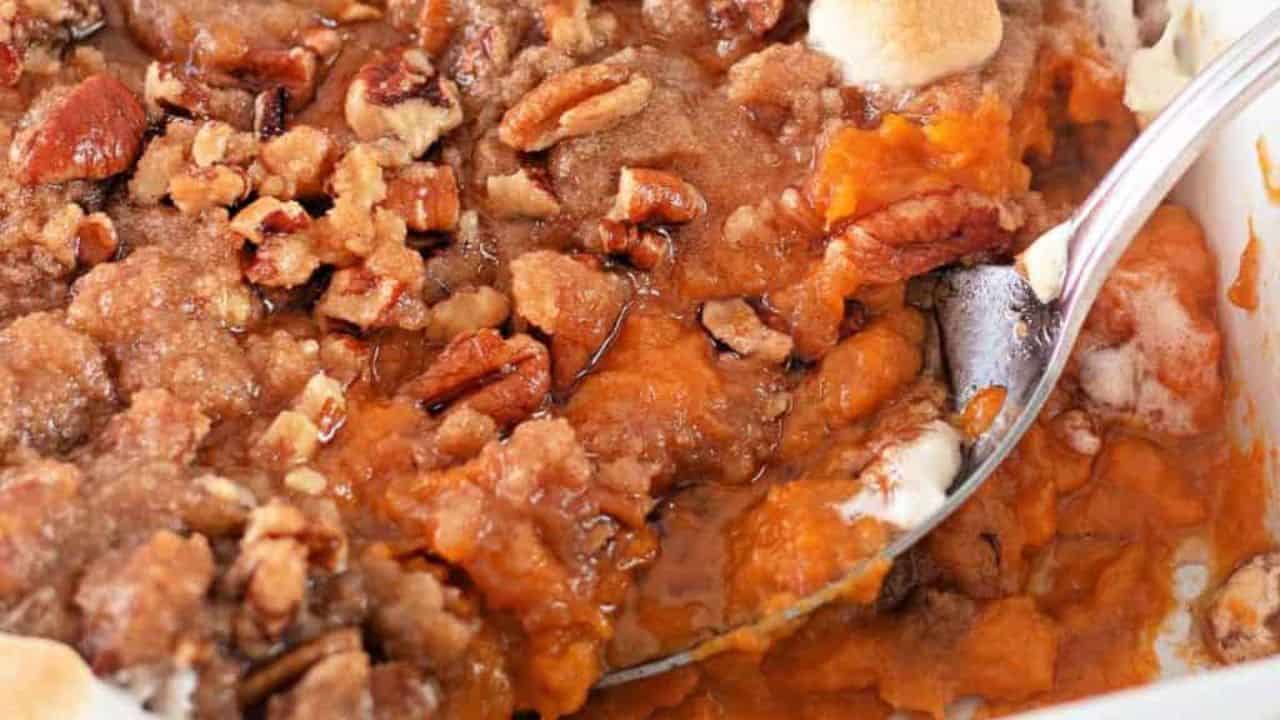 Sweet potatoes with pecans and marshmallows on top.
