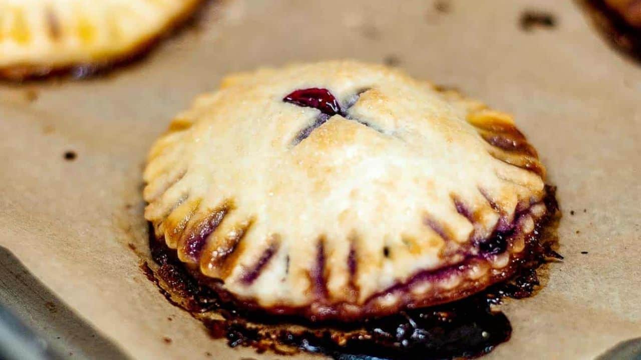 Closeup of a broken open triple berry hand pie.