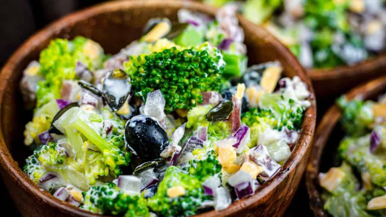 Broccoli Salad with Bacon inside wooden bowl.
