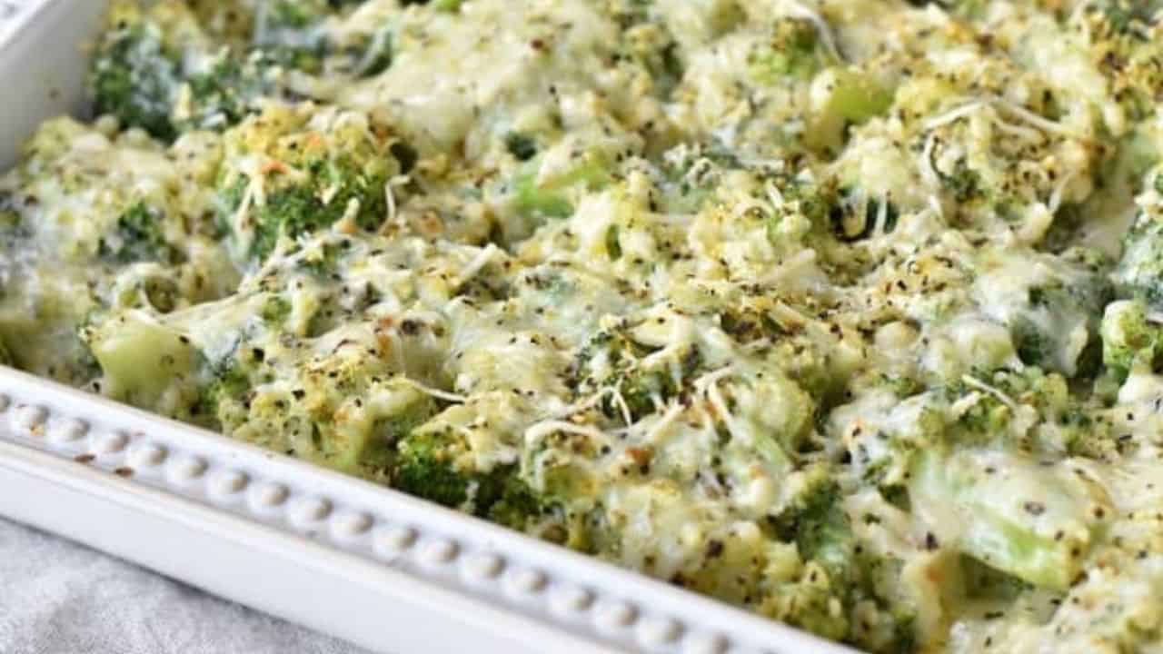 A casserole dish filled with broccoli and cheese.