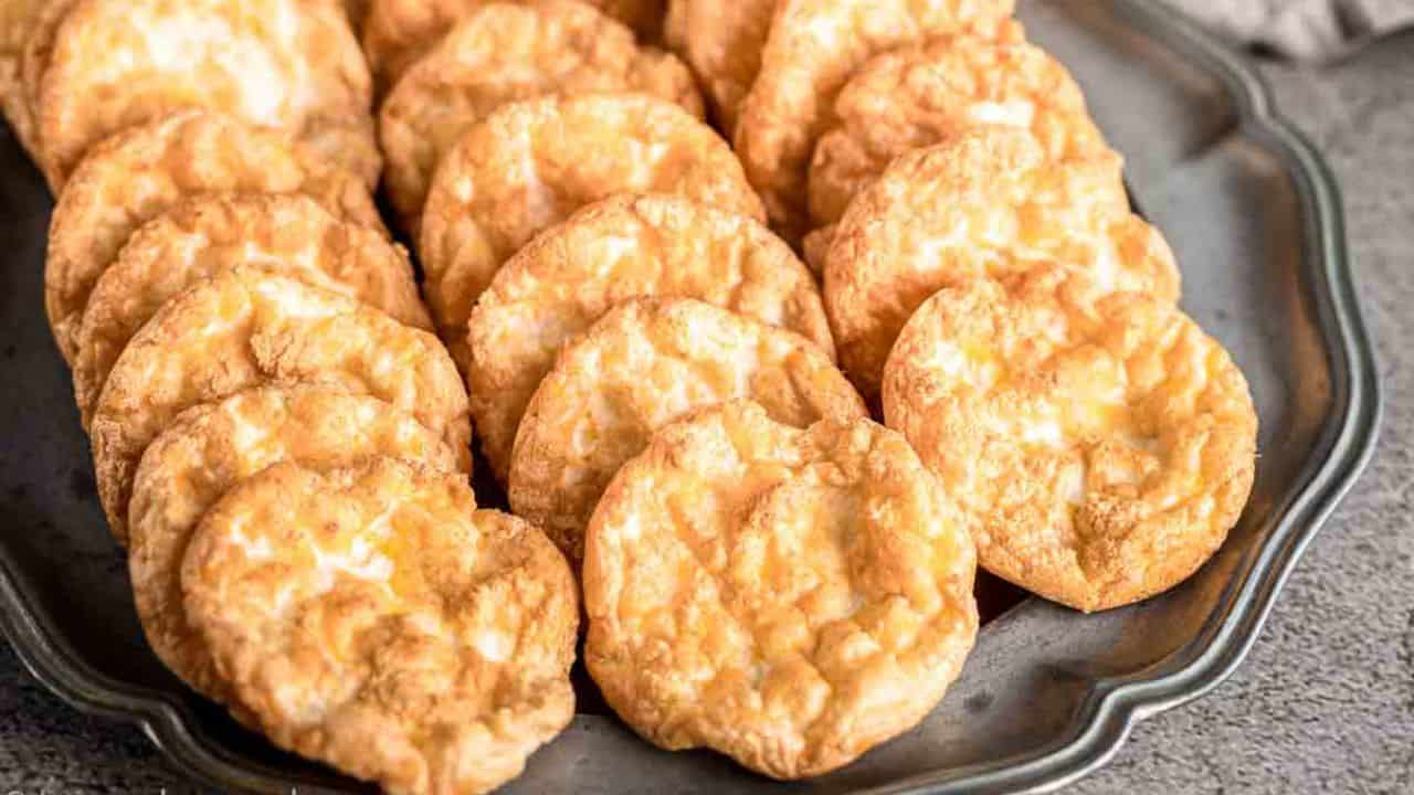 Cloud Egg Crisps on a plate with wine in the background.