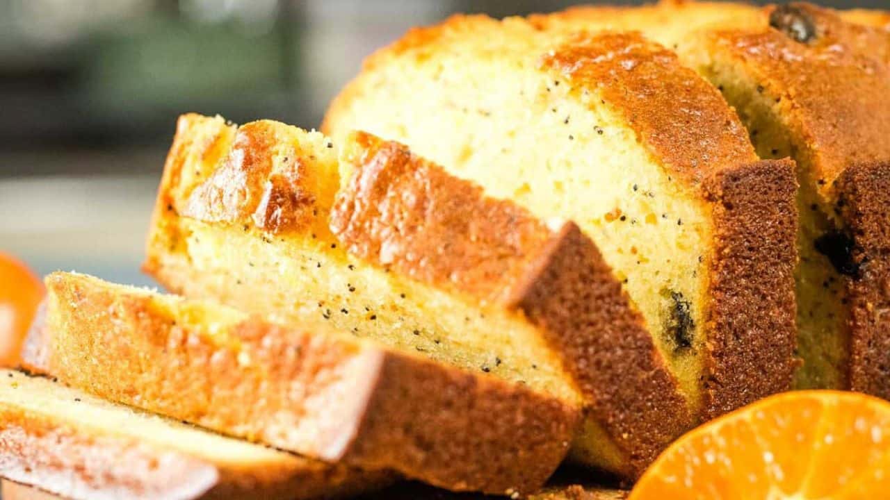 Cranberry clementine quick bread topped with orange glaze.