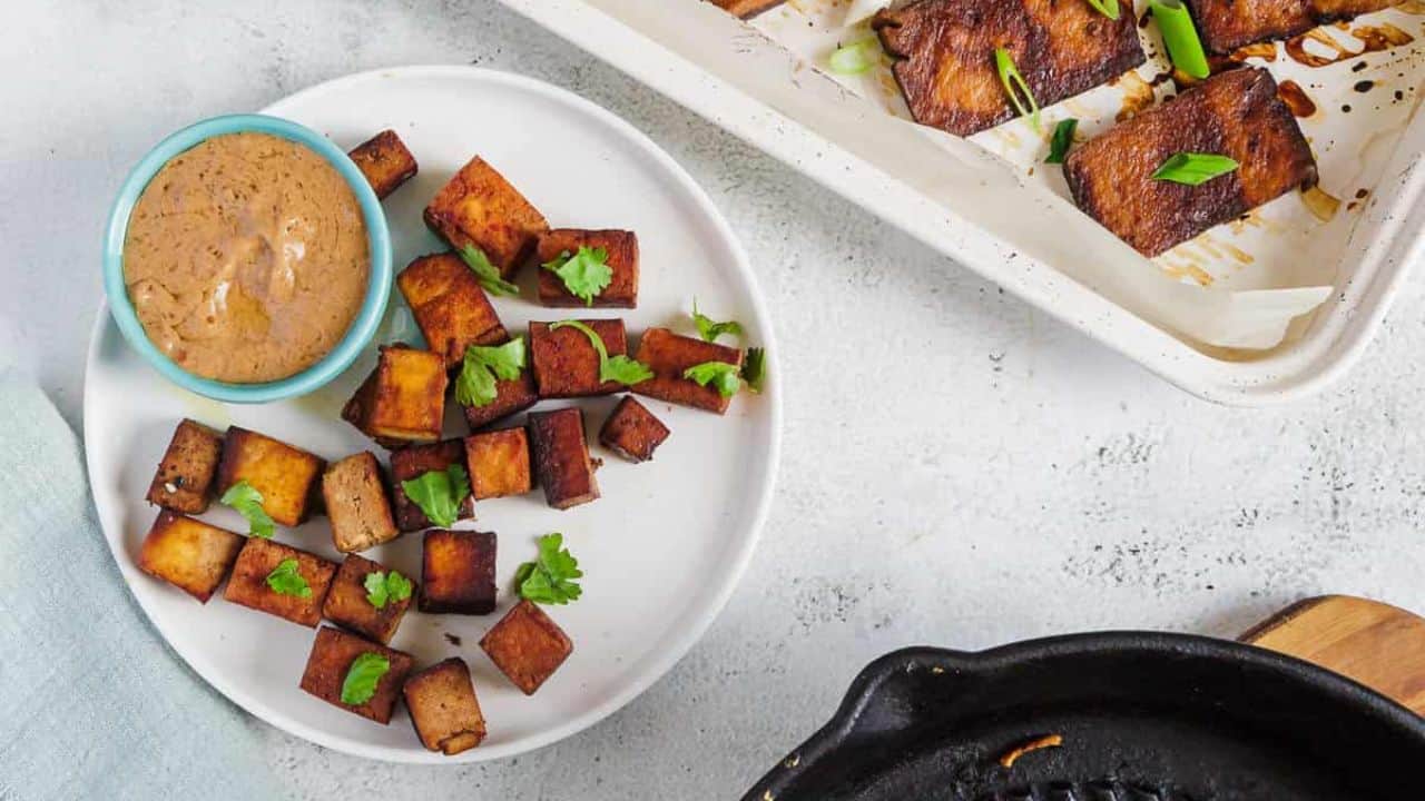 A bowl of soup with a spoon in it.