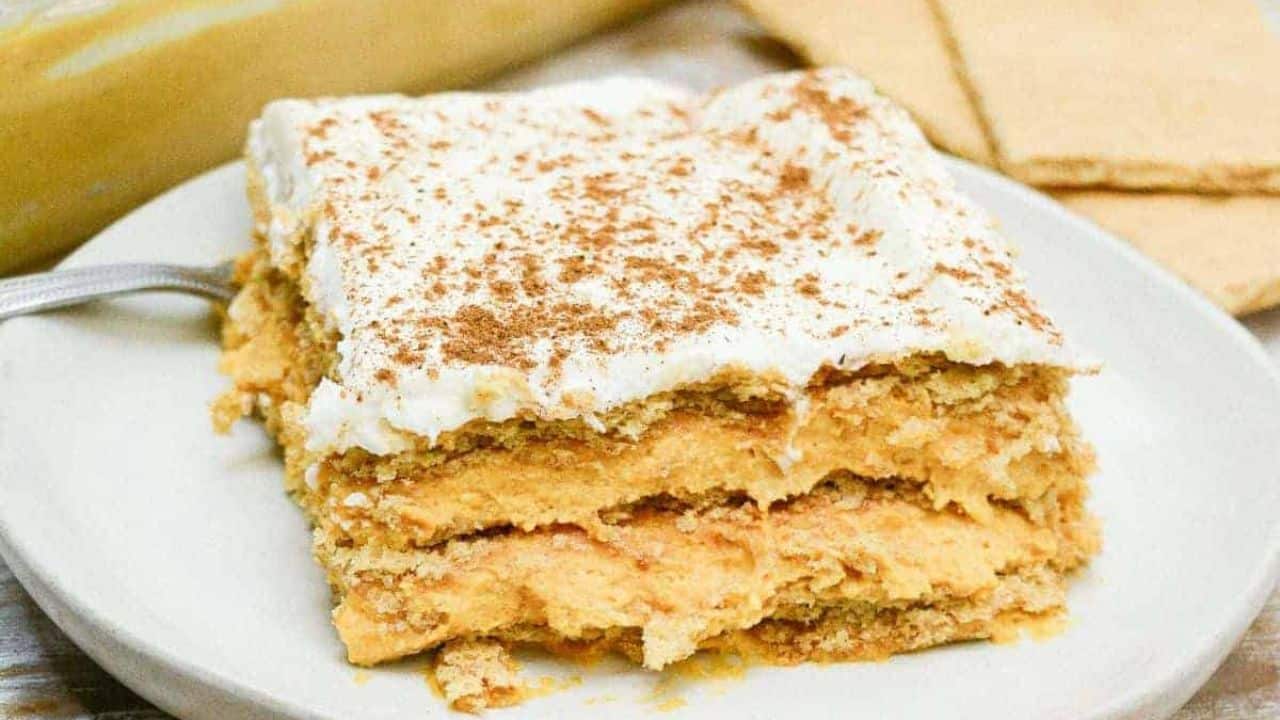 A piece of no-bake pumpkin icebox cake on a white plate.