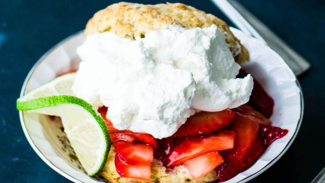 Strawberry shortcake with brown sugar biscuits and whipped cream.