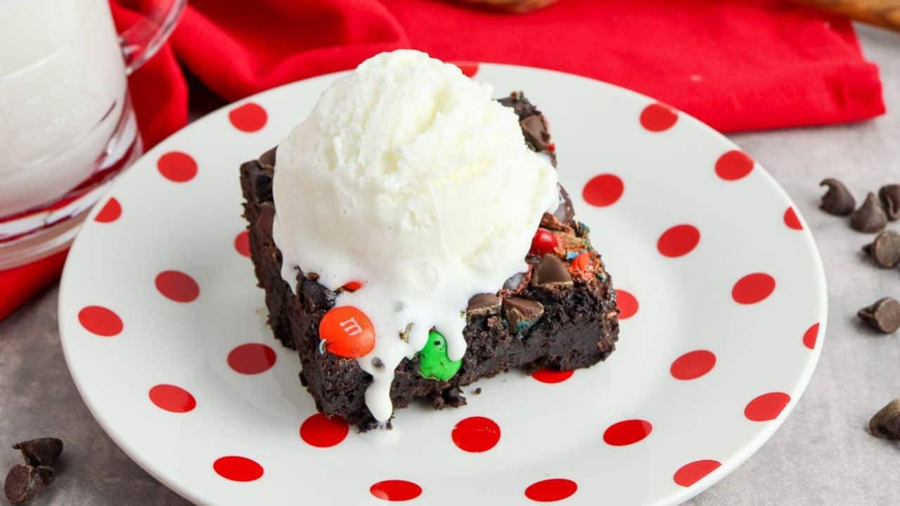 Chocolate dump cake topped with colorful M&Ms.