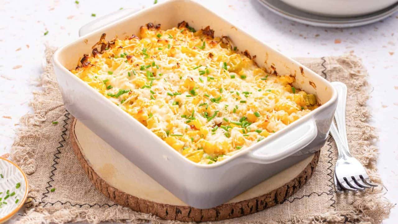 An image of corn casserole with cream cheese, ready to be served.