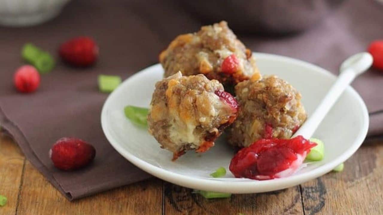 Cranberry sausage cheddar balls with cranberry dipping sauce.