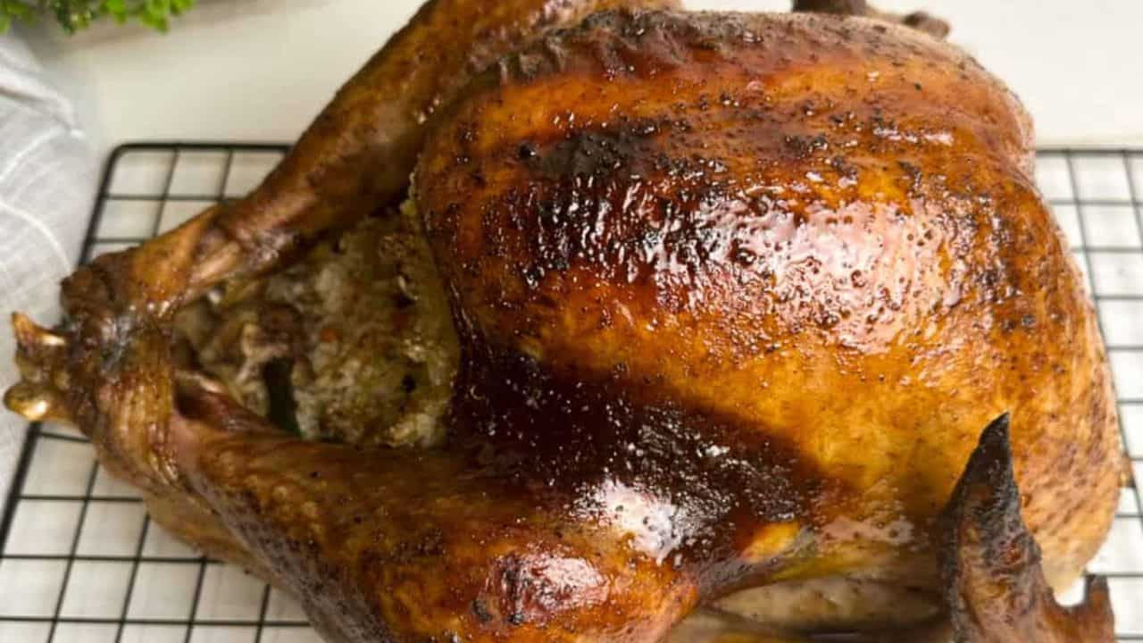 Juicy Asian-style roast turkey stuffed with flavorful sticky rice on a plate.
