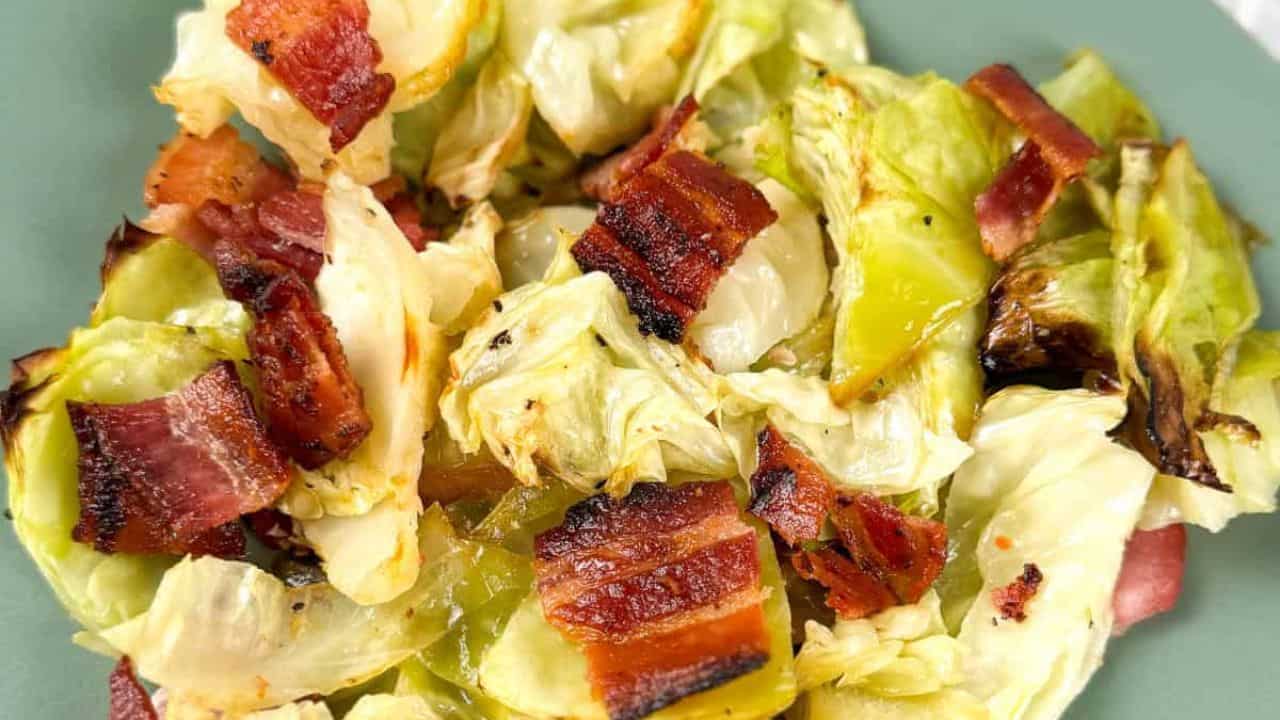 Baked cabbage with bacon on a green plate.