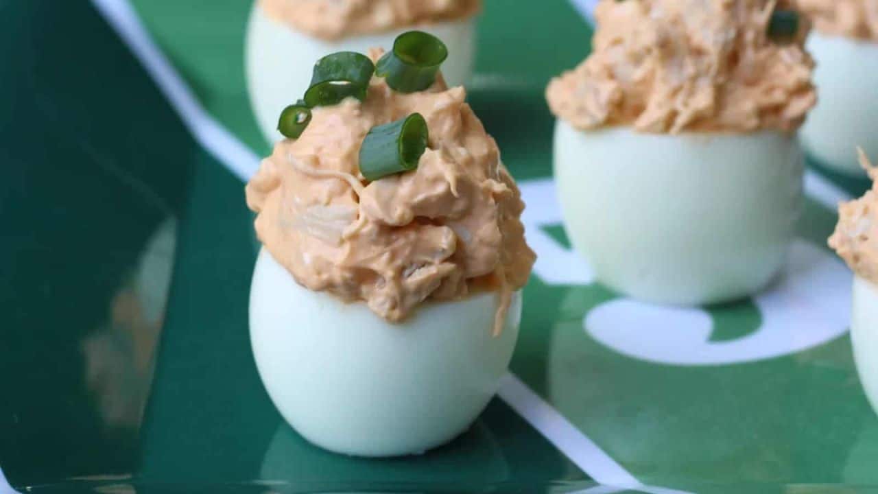 Football themed green plate with deviled eggs.