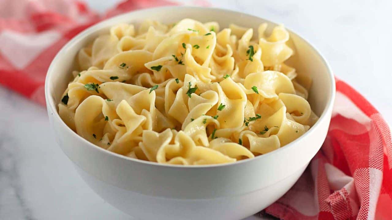 A bowl of buttered noodles.