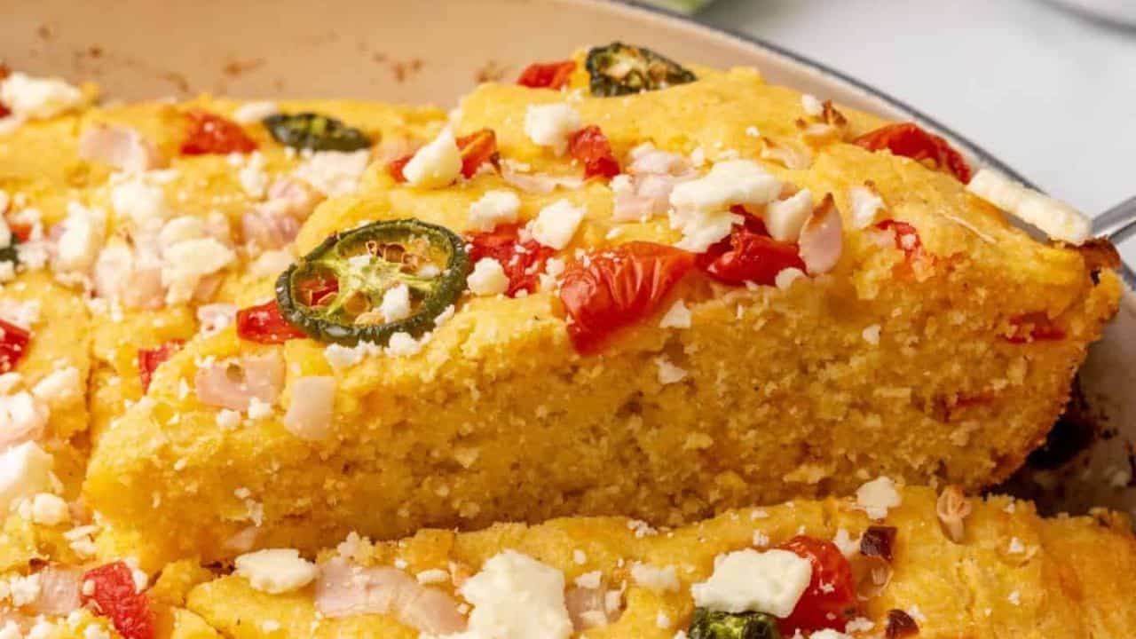 Iron skillet cornbread filled with vegetables and cheese.
