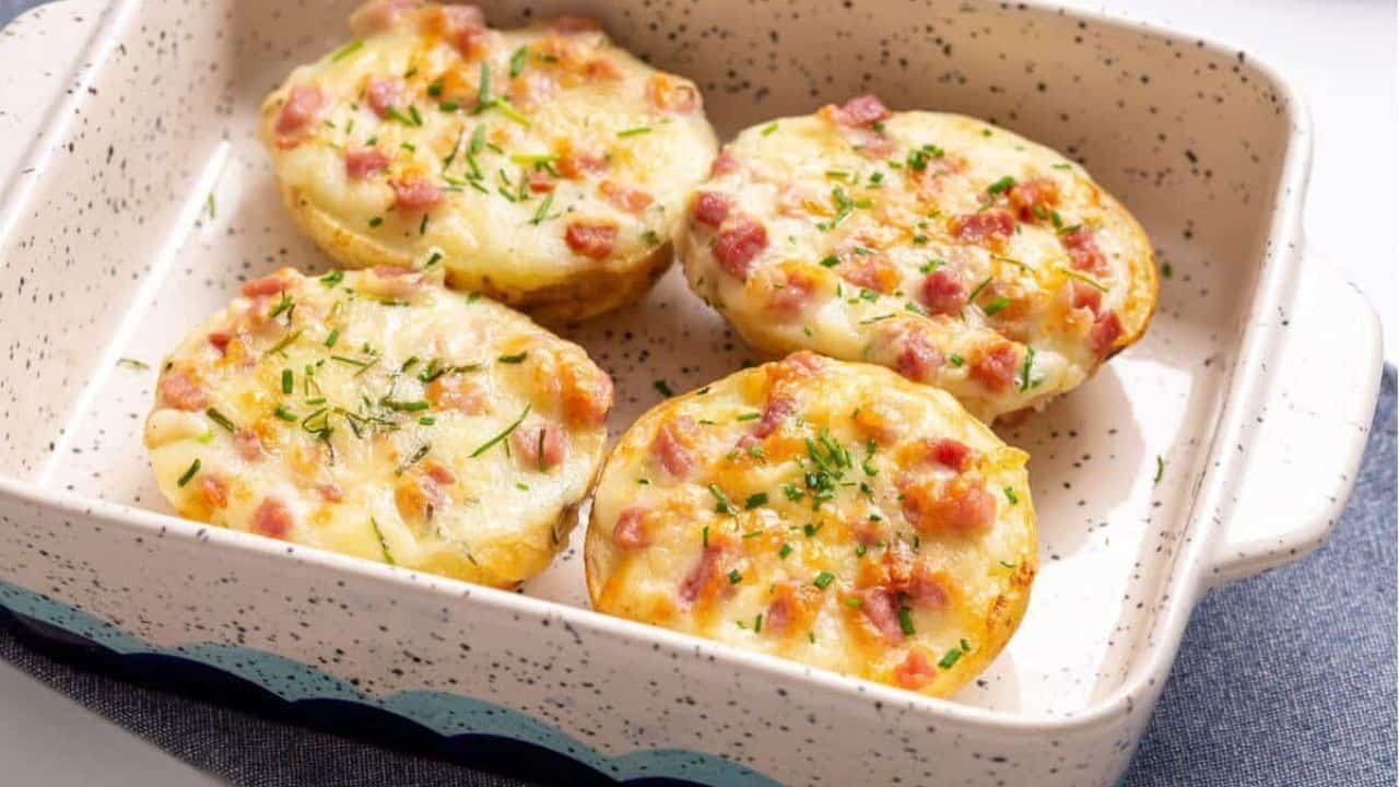 Four twice baked potatoes in a small baking dish.