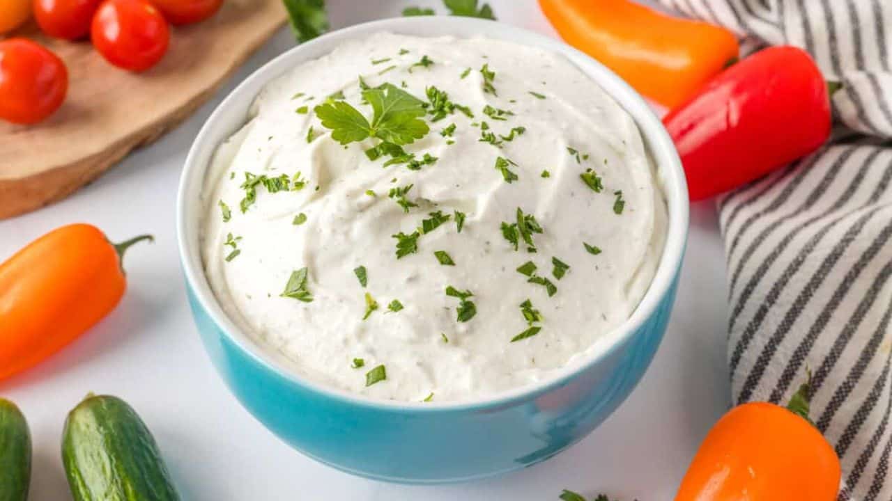 An close up image of cottage cheese ranch dip in a bowl.