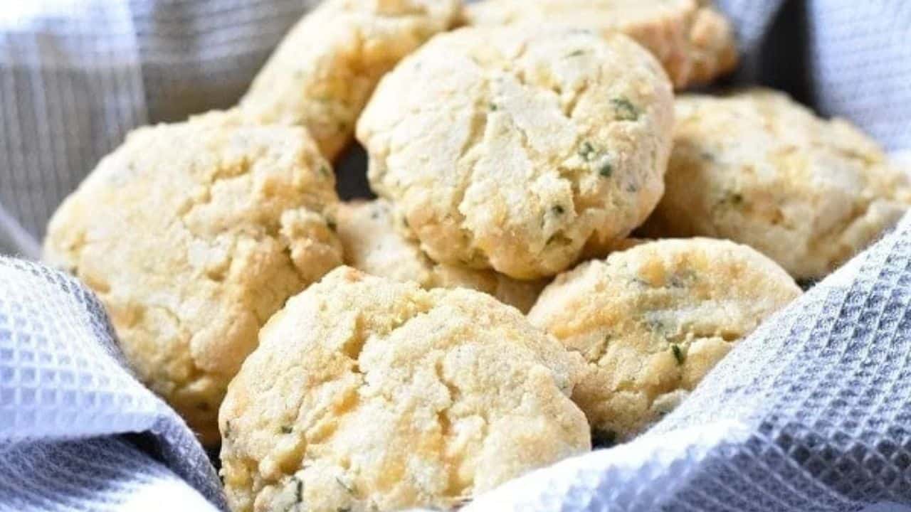 Cheesy garlic biscuits in a blue and white cloth.