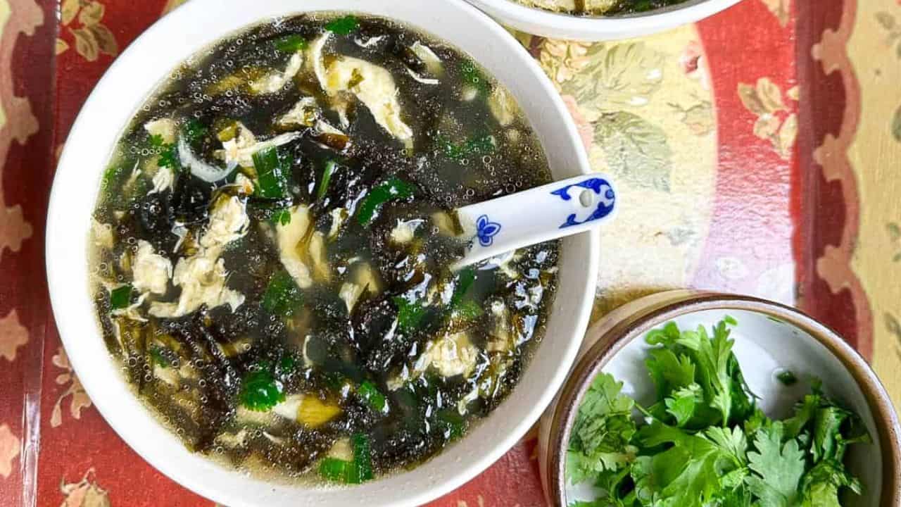Light and soothing Chinese egg drop soup with seaweed in a bowl.