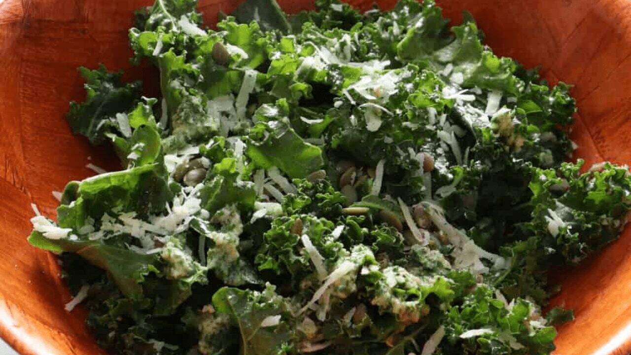 An overhead image of two bowls of lemon garlic kale salad.